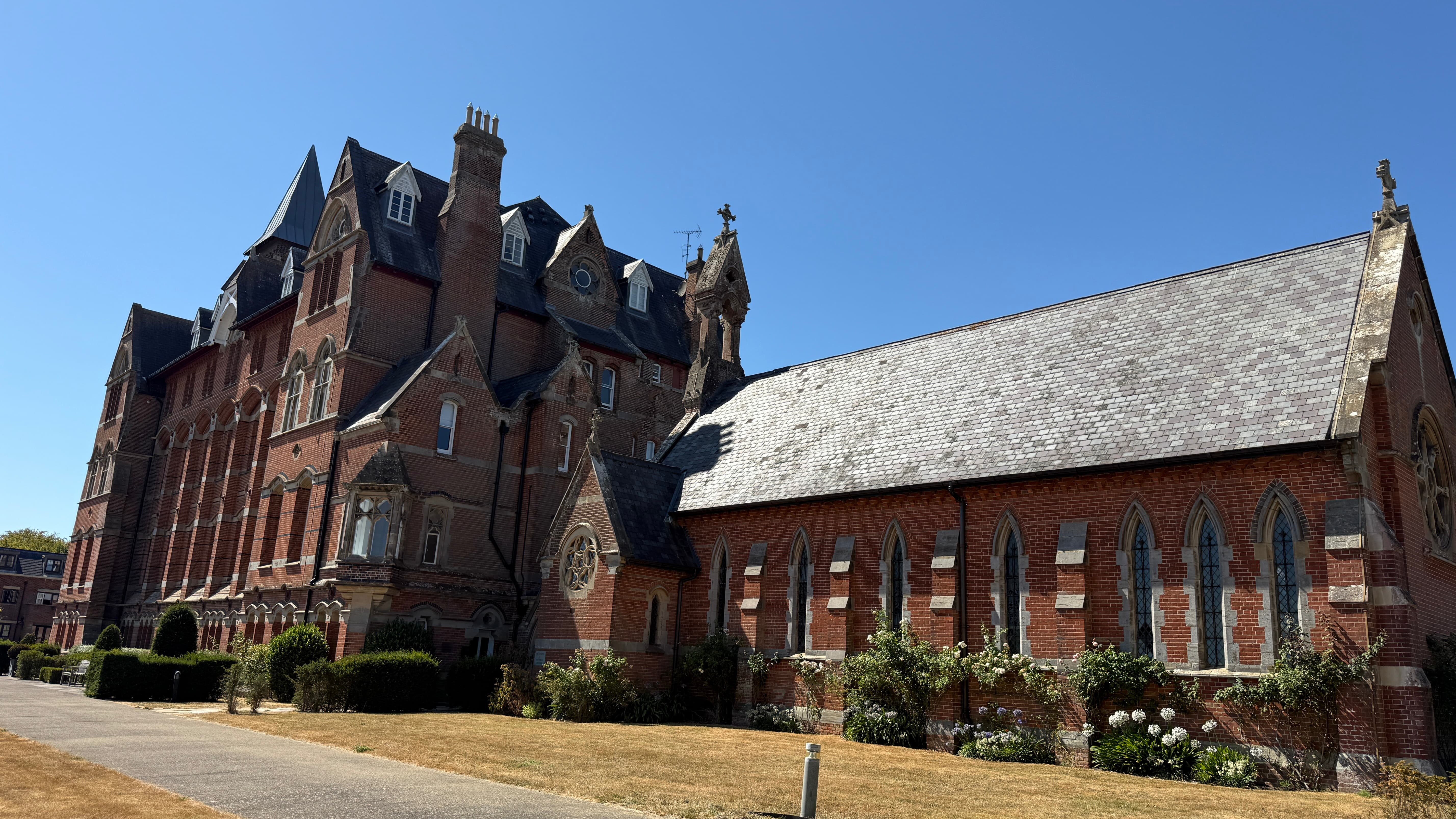 Mayfield College an old red brick 3 storey building on the right is a chapel