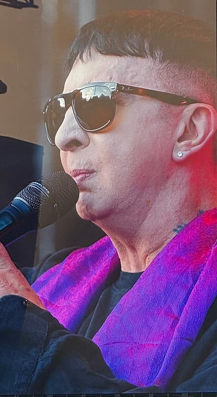 A close up of Marc Almond singing