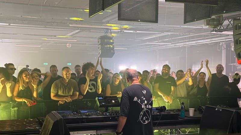 Rear shot of Dave Clarke DJing to the Bugged Out Crowd