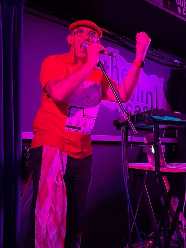 Me on stage shouting More Acid into a microphone