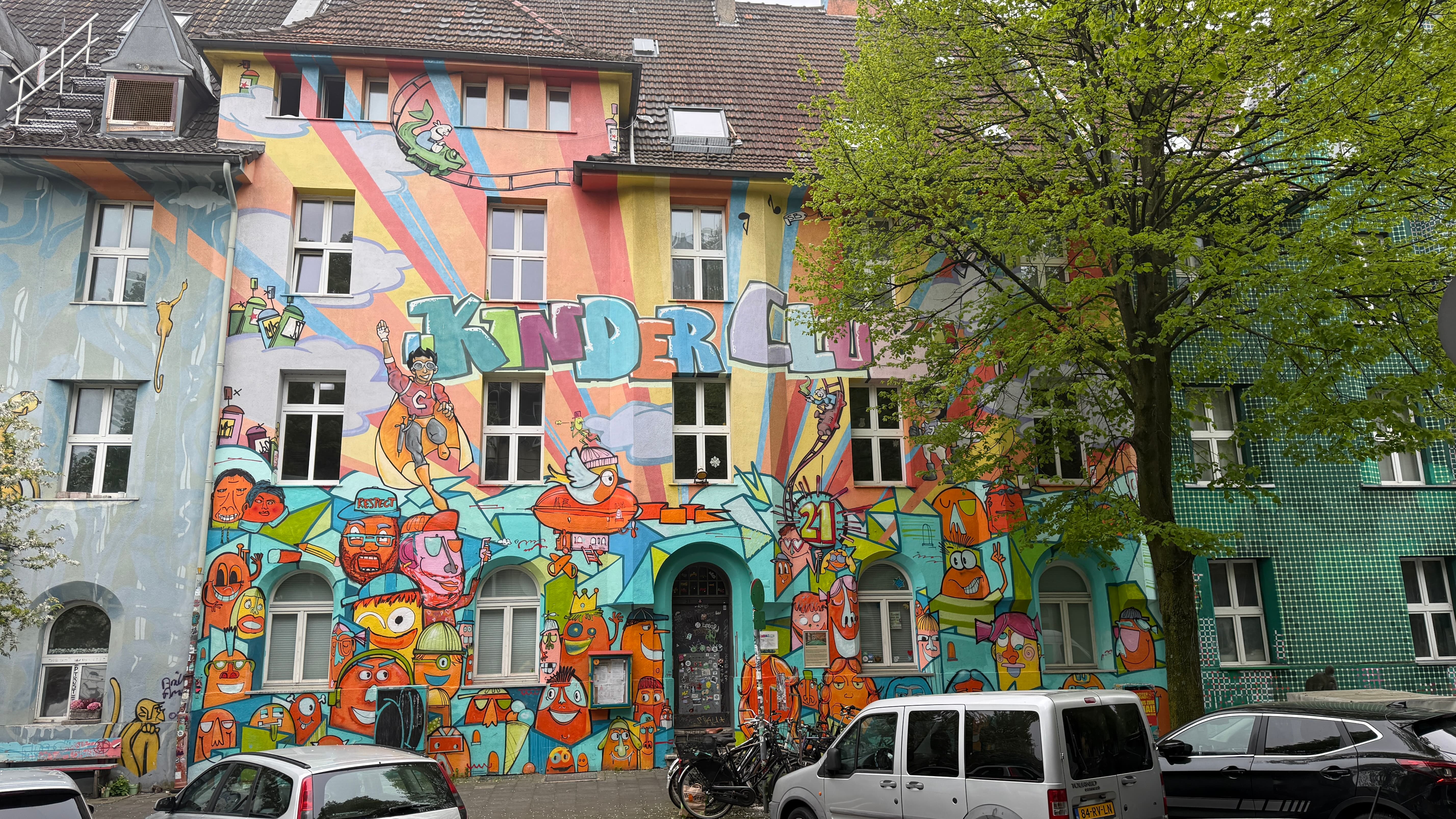 Kinder Club (Childrens club) on Kiefernstraße, the build is colourfully painted with superheroes and minion type characters
