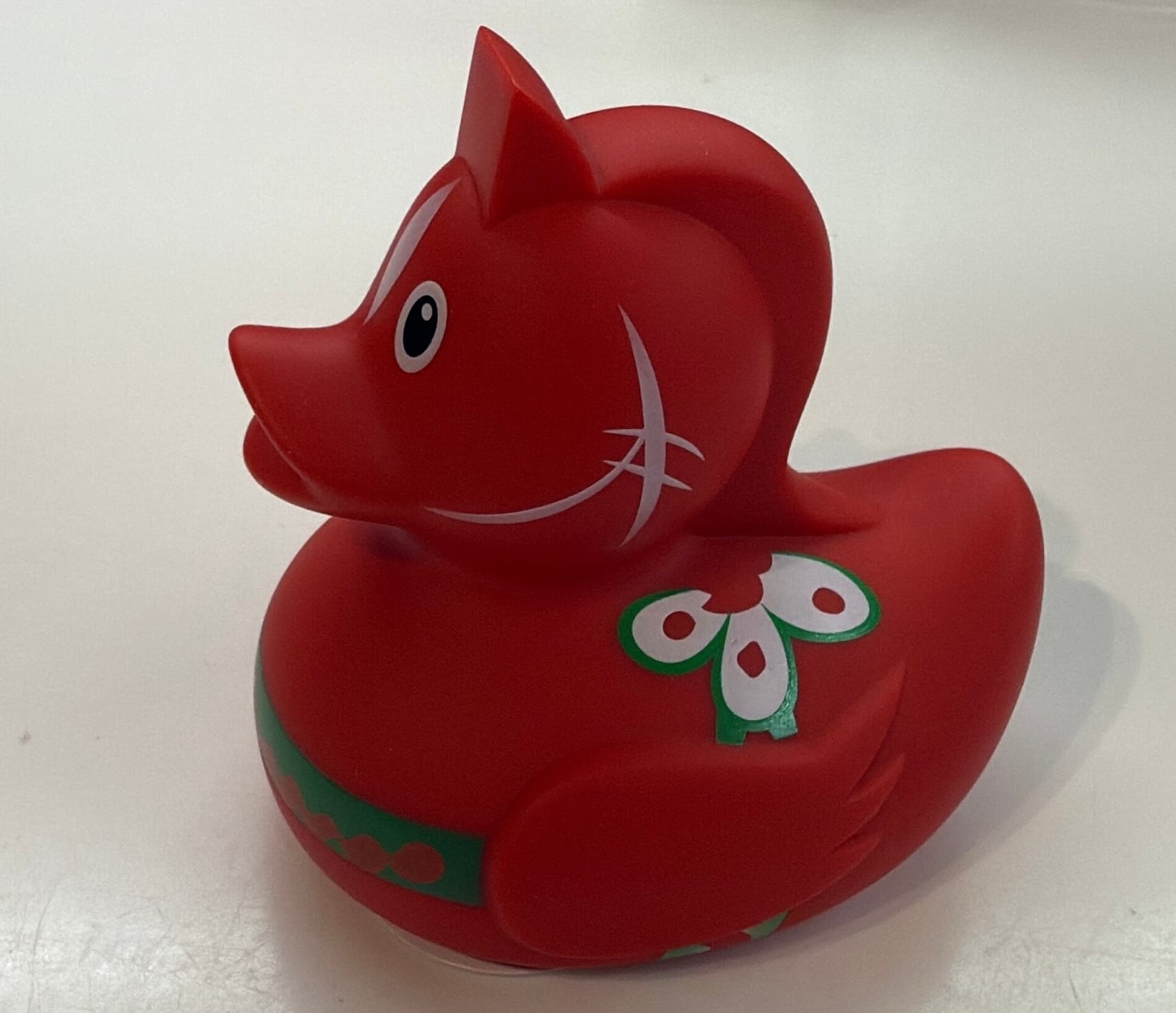 A red rubber duck which is styled like a Swedish Red Wooden Horse