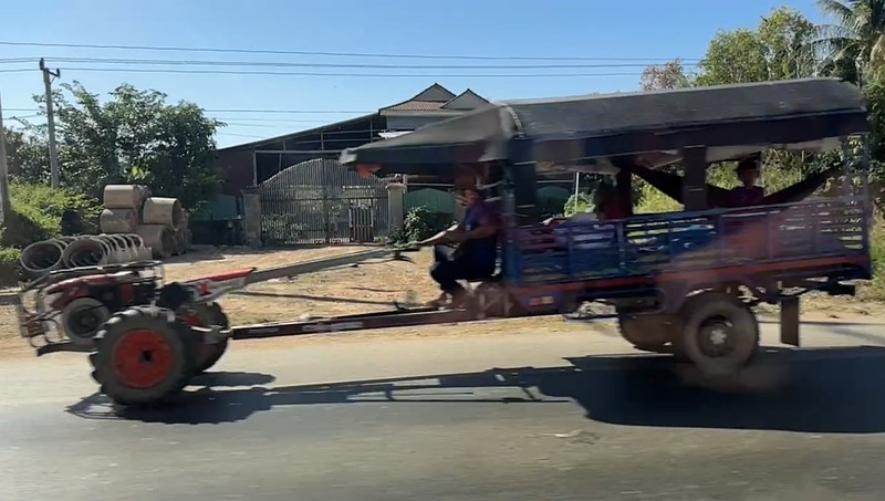A vehicle that is basically a lawn mower engine attached to a trailer doing about 40 km/hr