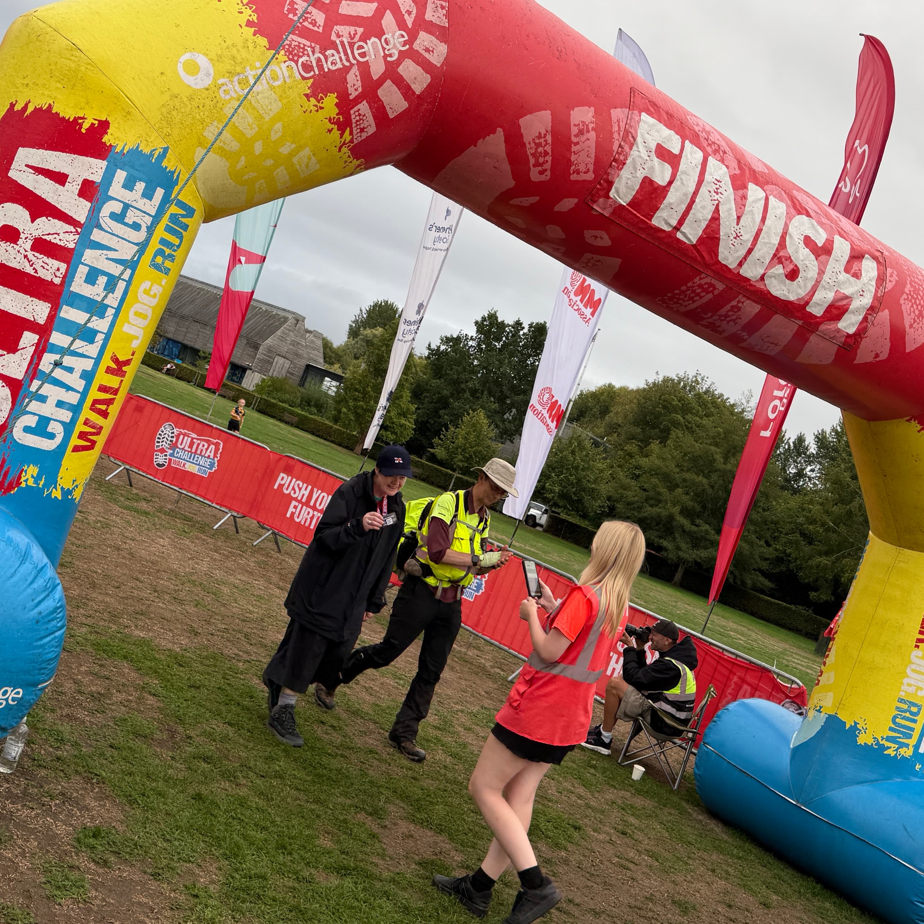 Susan crossing the finish line