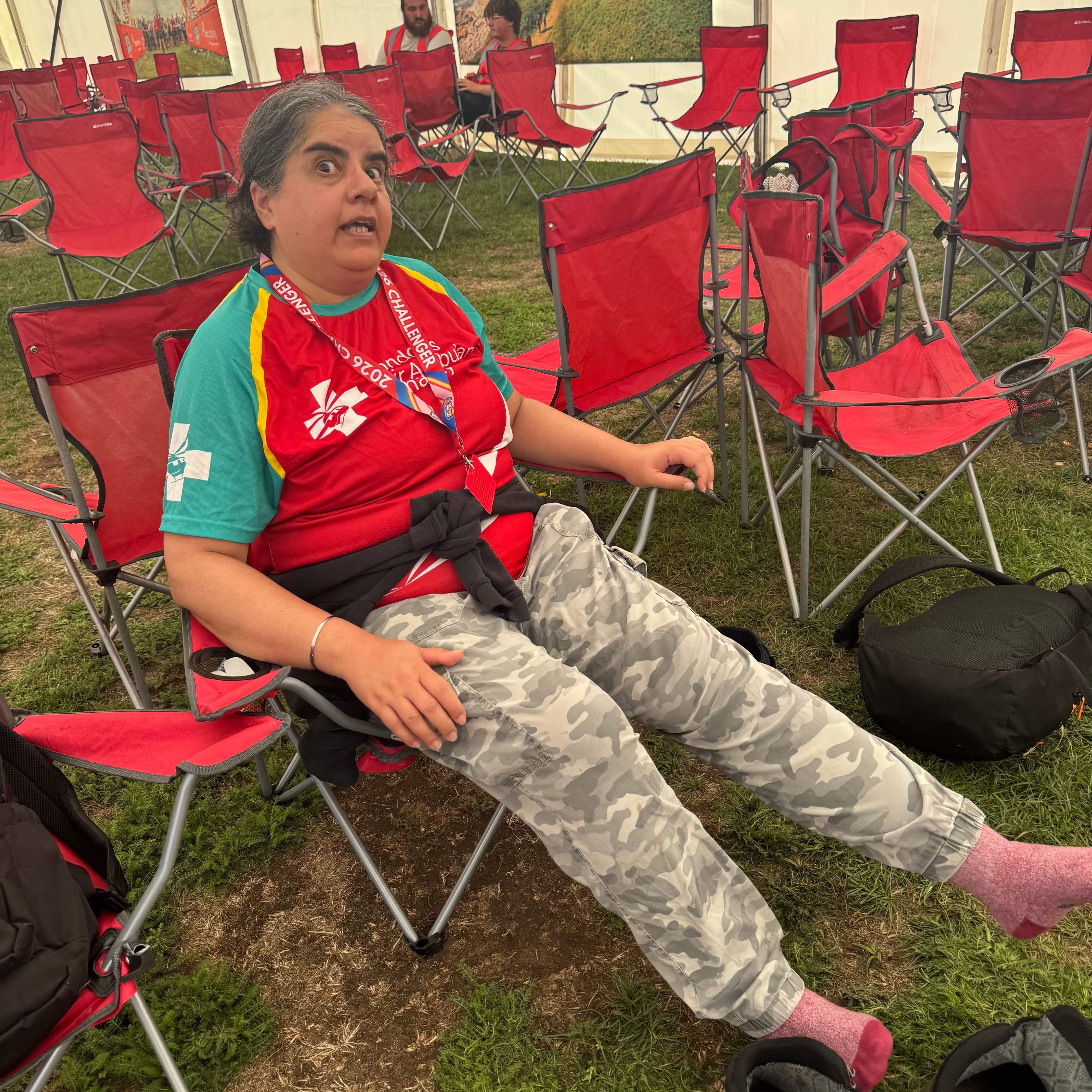 Susan's friend relaxing with her walking boots off at Rest Stage 2 of Thames Path Challenge