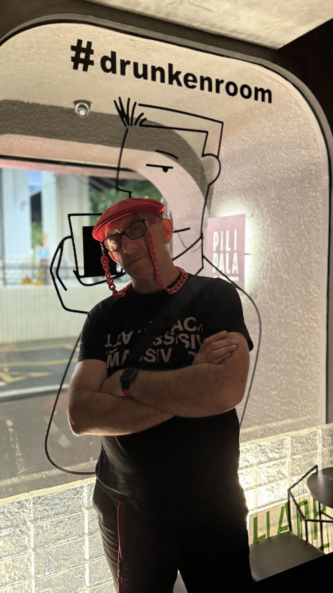 Me standing in the window of the Drunken Room cocktail bar, looking happy with myslef